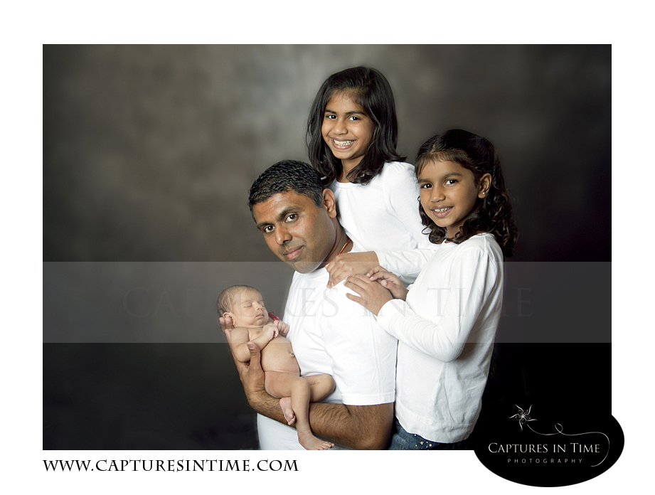 Kansas City Newborn Photo with the family on old world backdrop
