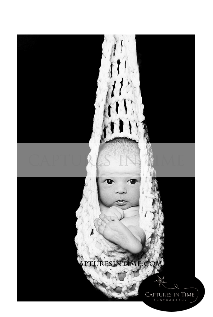 Kansas City Newborn Photographer Hanging Baby Basket Pose