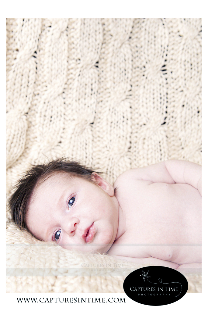 3 Weeks Kansas City Newborn Photographer baby laying on cream blanket