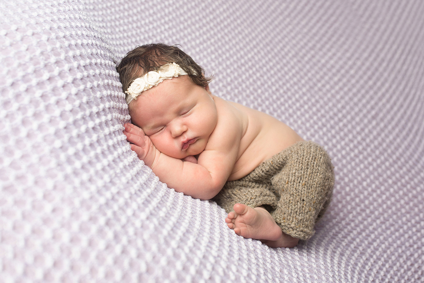 newborn girl on lavender brown pants