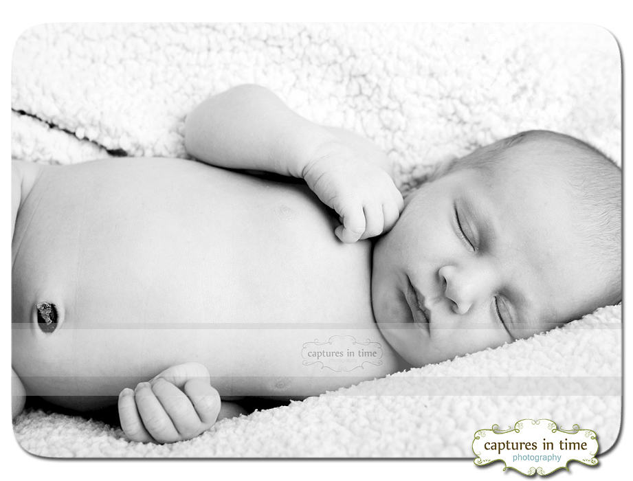 black and white with baby laying on side
