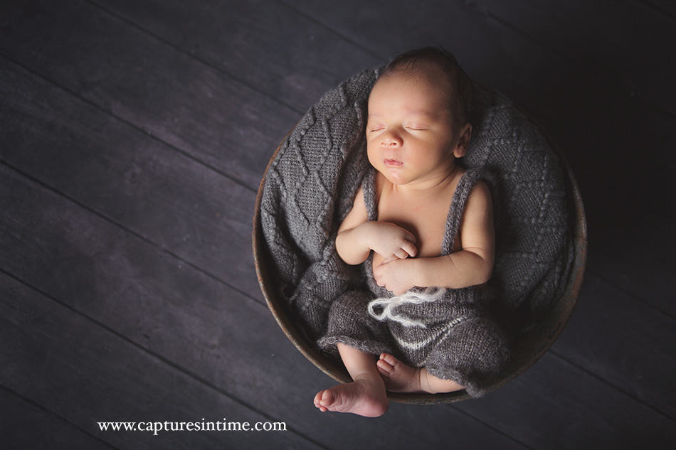 Kansas City photographer baby boy grey tones with grey romper on sleeping soundly