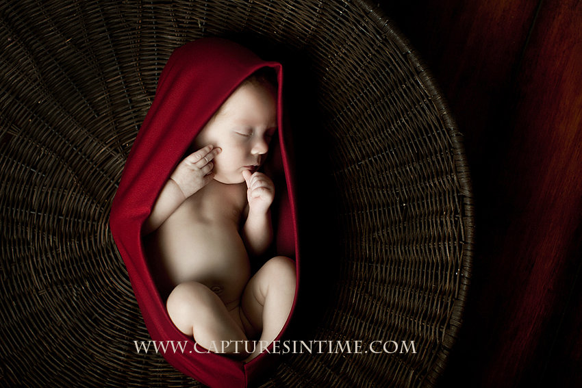 newborn girl in red pod Kansas City