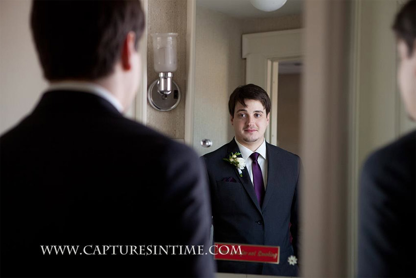 Simpson House Kansas City groom looking in mirror 