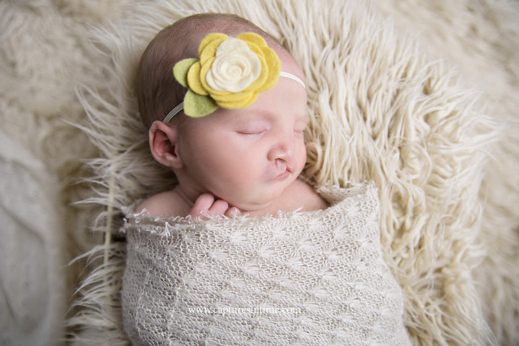 kansas city newborn baby photography Newborn baby girl with yellow felt flower headband