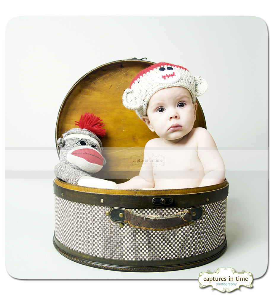 Kansas City Baby Photographer sock monkey baby in basket hat