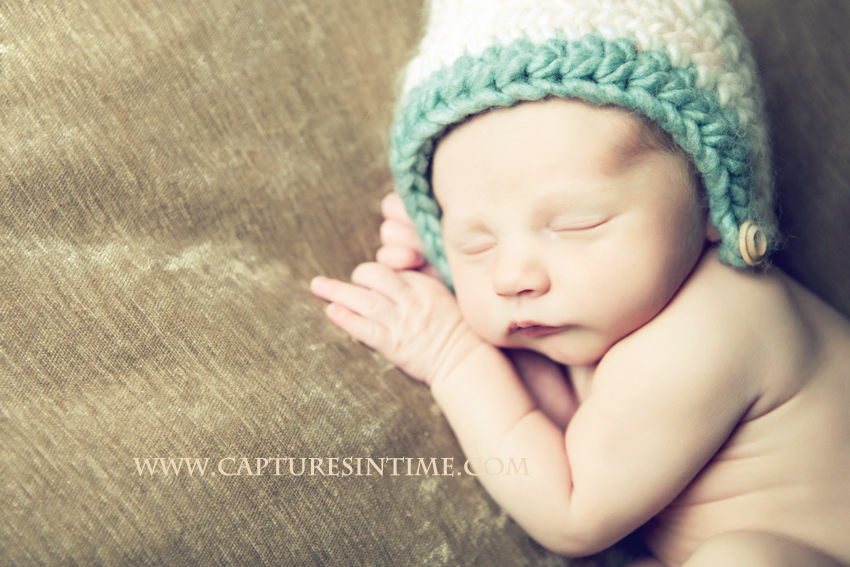 Kansas City newborn in blue and cream hat