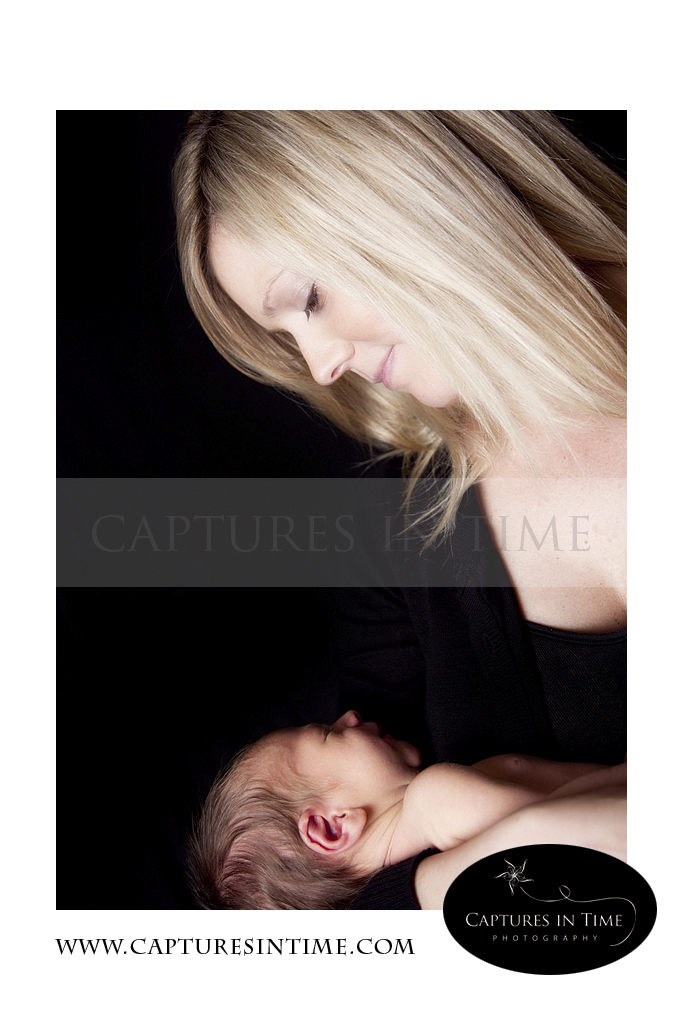Kansas City Newborn Photos blonde mom with baby looking down lovingly
