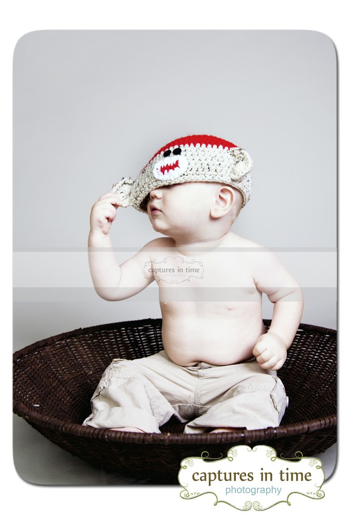 toddler in sock monkey hat
