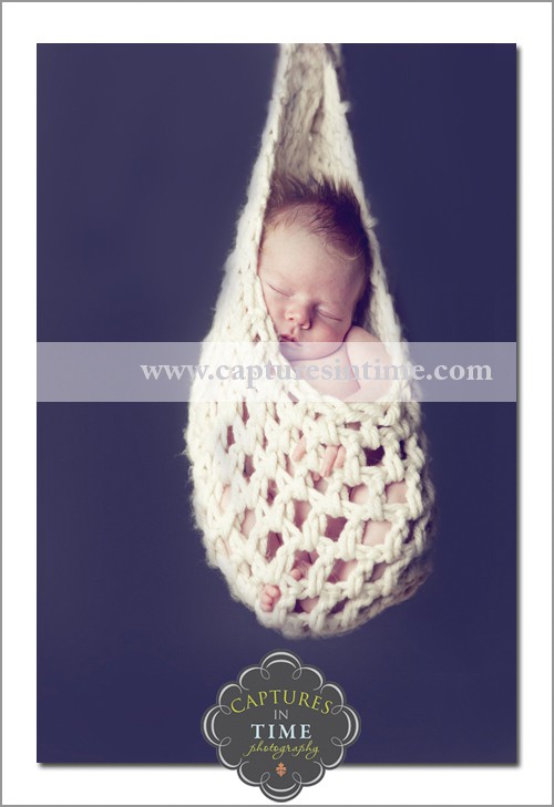 Kansas City Newborn Photographer baby in hanging basket