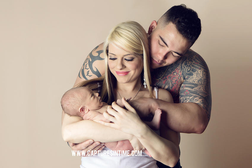 tattoo dad with mom holding newborn