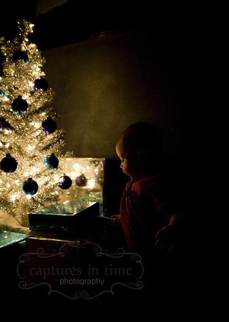 baby by Christmas tree